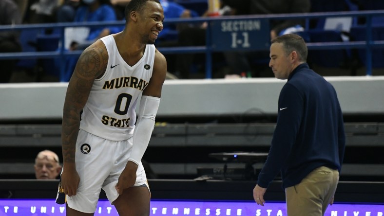 Feb 10, 2022; Nashville, Tennessee, USA; Murray State Racers forward KJ Williams (0) and head coach Matt McMahon (right) celebrate after a win against the Tennessee State Tigers at Gentry Complex. Mandatory Credit: Christopher Hanewinckel-USA TODAY Sports