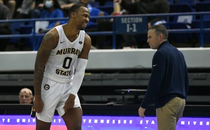 Feb 10, 2022; Nashville, Tennessee, USA; Murray State Racers forward KJ Williams (0) and head coach Matt McMahon (right) celebrate after a win against the Tennessee State Tigers at Gentry Complex. Mandatory Credit: Christopher Hanewinckel-USA TODAY Sports