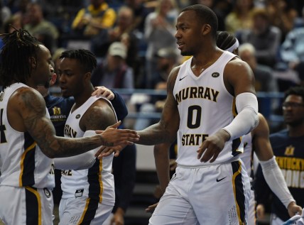 Feb 10, 2022; Nashville, Tennessee, USA; Murray State Racers forward KJ Williams (0) is congratulated by teammates after a basket during the second half against the Tennessee State Tigers at Gentry Complex. Mandatory Credit: Christopher Hanewinckel-USA TODAY Sports
