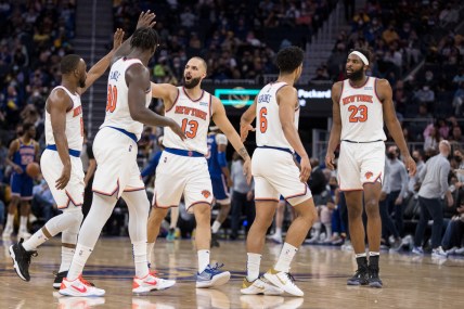 Feb 10, 2022; San Francisco, California, USA; New York Knicks guard Evan Fournier (13) celebrates with guard Kemba Walker (8) and forward Julius Randle (30) after a foul is called on a Golden State Warriors player during the second half at Chase Center. Mandatory Credit: John Hefti-USA TODAY Sports