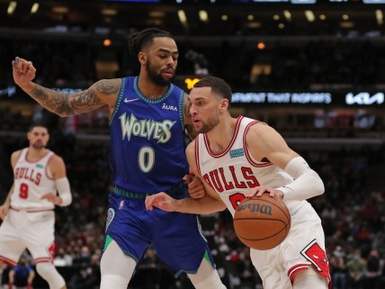 Feb 11, 2022; Chicago, Illinois, USA; Chicago Bulls guard Zach LaVine (8) drives around Minnesota Timberwolves guard D'Angelo Russell (0) during the first half at the United Center. Mandatory Credit: Dennis Wierzbicki-USA TODAY Sports