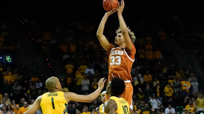 Feb 12, 2022; Waco, Texas, USA;  Texas Longhorns forward Tre Mitchell (33) shoots over Baylor Bears forward Jeremy Sochan (1) during the first half at Ferrell Center. Mandatory Credit: Chris Jones-USA TODAY Sports