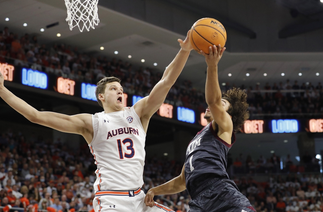 Feb 12, 2022; Auburn, Alabama, USA;  Texas A&M Aggies guard Marcus Williams (1) has his shot blocked by Auburn Tigers forward Walker Kessler (13) during the first half at Auburn Arena. Mandatory Credit: John Reed-USA TODAY Sports