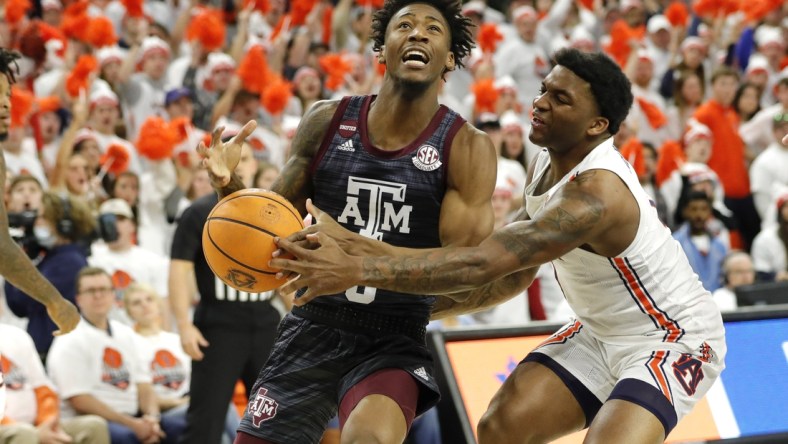 Feb 12, 2022; Auburn, Alabama, USA;  Texas A&M Aggies guard Quenton Jackson (3) is fouled by Auburn Tigers guard K.D. Johnson (0) during the first half at Auburn Arena. Mandatory Credit: John Reed-USA TODAY Sports