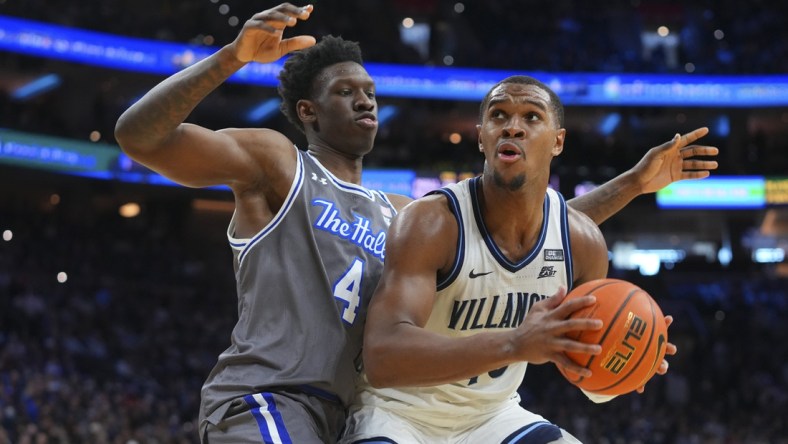 Feb 12, 2022; Philadelphia, Pennsylvania, USA; Villanova Wildcats forward Eric Dixon (43) controls the ball against Seton Hall Pirates forward Tyrese Samuel (4) in the second half at the Wells Fargo Center. Mandatory Credit: Mitchell Leff-USA TODAY Sports