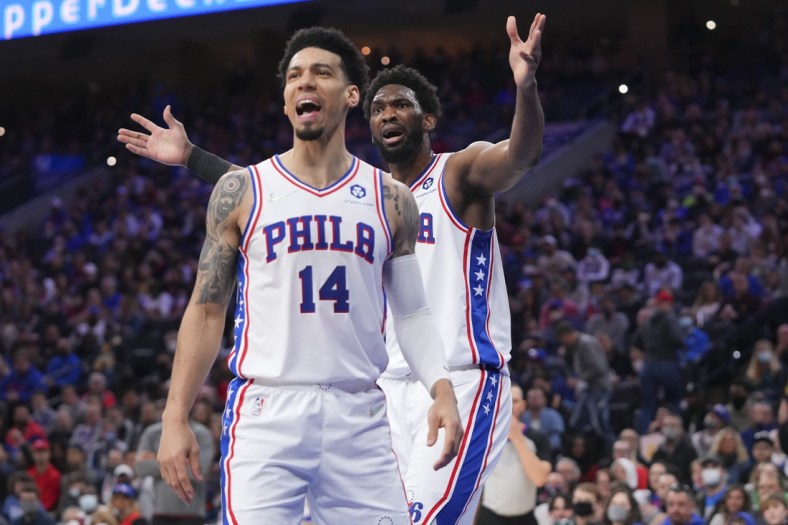 Feb 12, 2022; Philadelphia, Pennsylvania, USA; Philadelphia 76ers forward Danny Green (14) and center Joel Embiid (21) react after a foul called on Embiid against the Cleveland Cavaliers in the first half at the Wells Fargo Center. Mandatory Credit: Mitchell Leff-USA TODAY Sports