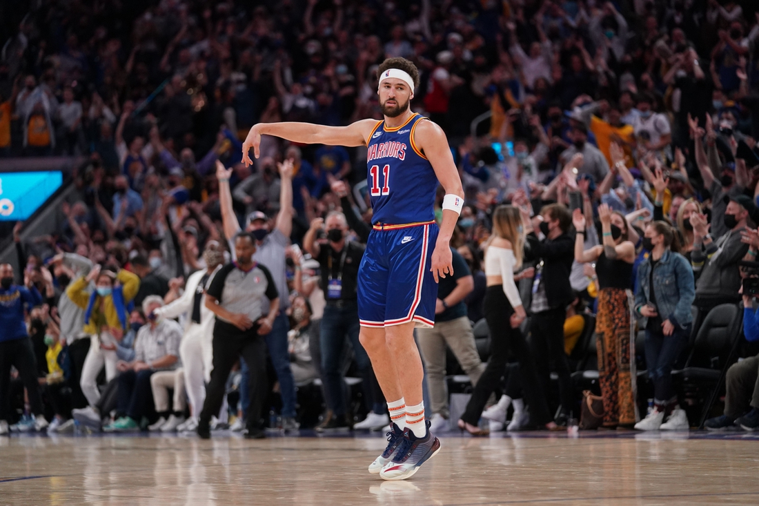 Feb 12, 2022; San Francisco, California, USA; Golden State Warriors guard Klay Thompson (11) reacts after making a three point basket against the Los Angeles Lakers in the fourth quarter at the Chase Center. Mandatory Credit: Cary Edmondson-USA TODAY Sports