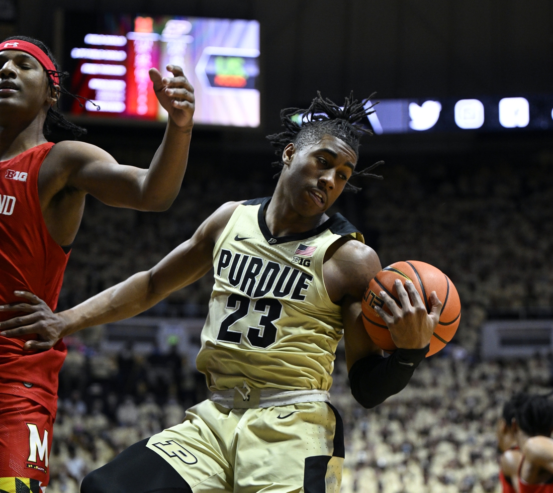 Feb 13, 2022; West Lafayette, Indiana, USA;  Purdue Boilermakers guard Jaden Ivey (23) grabs a rebound during the first half against the Maryland Terrapins at Mackey Arena. Mandatory Credit: Marc Lebryk-USA TODAY Sports