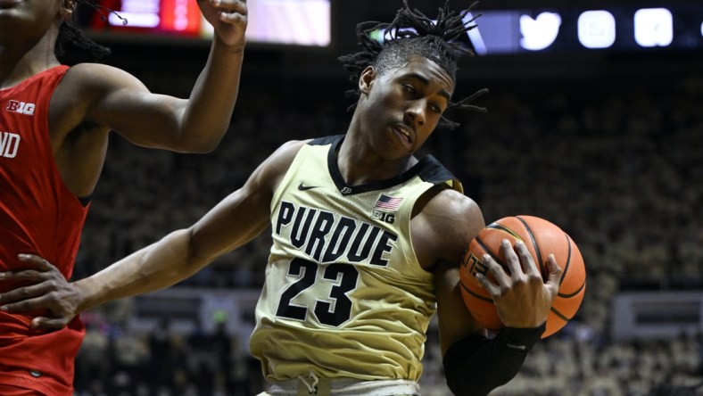 Feb 13, 2022; West Lafayette, Indiana, USA;  Purdue Boilermakers guard Jaden Ivey (23) grabs a rebound during the first half against the Maryland Terrapins at Mackey Arena. Mandatory Credit: Marc Lebryk-USA TODAY Sports