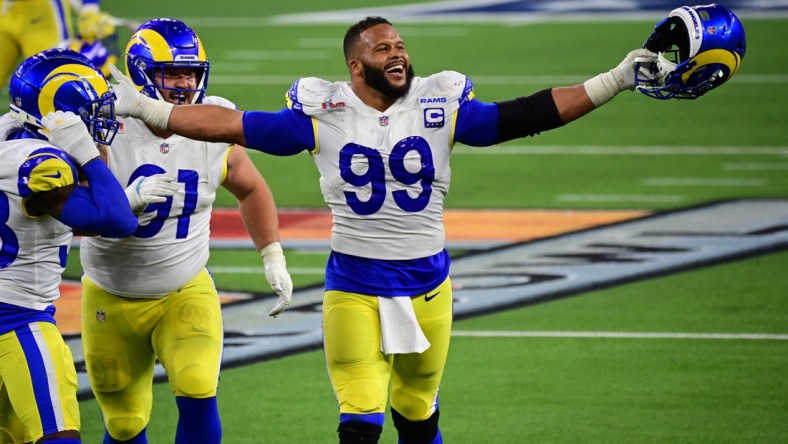 Feb 13, 2022; Inglewood, California, USA; Los Angeles Rams defensive tackle Aaron Donald (99) celebrates after a pressure in the fourth quarter against the Cincinnati Bengals in Super Bowl LVI at SoFi Stadium. Mandatory Credit: Gary A. Vasquez-USA TODAY Sports