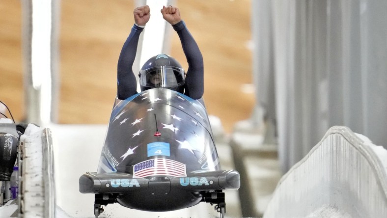 Feb 14, 2022; Yanqing, China; Elana Meyers Taylor (USA) celebrates winning the silver medal in the women   s monobob during the Beijing 2022 Olympic Winter Games at Yanqing Sliding Centre. Mandatory Credit: Harrison Hill-USA TODAY Sports