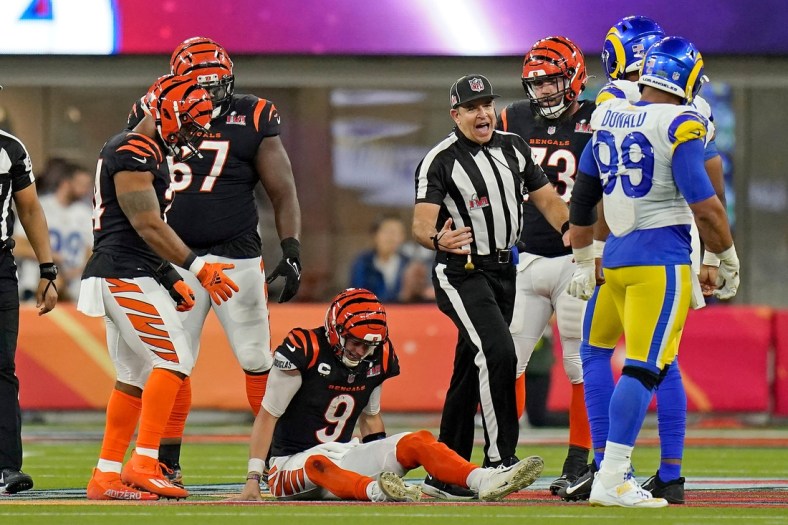 Cincinnati Bengals quarterback Joe Burrow (9) is slow to his feet after being sacked in the fourth quarter of Super Bowl 56 between the Cincinnati Bengals and the Los Angeles Rams at SoFi Stadium in Inglewood, Calif., on Sunday, Feb. 13, 2022. The Rams came back in the final minutes of the game to win 23-20 on their home field.

Super Bowl 56 Cincinnati Bengals Vs La Rams