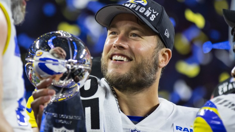 Feb 13, 2022; Inglewood, CA, USA; Los Angeles Rams quarterback Matthew Stafford celebrates with the Lombardi Trophy after defeating the Cincinnati Bengals in Super Bowl LVI at SoFi Stadium. Mandatory Credit: Mark J. Rebilas-USA TODAY Sports