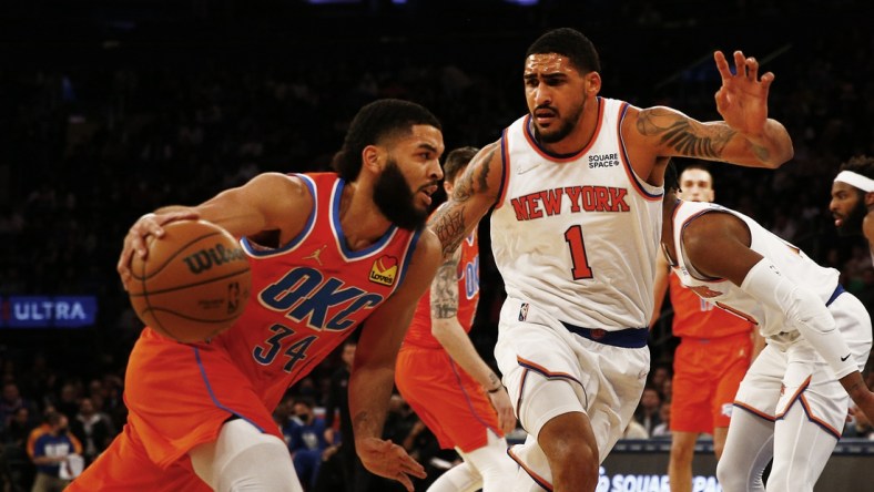 Feb 14, 2022; New York, New York, USA; Oklahoma City Thunder forward Kenrich Williams (34) dribbles the ball against New York Knicks forward Obi Toppin (1) during the first half at Madison Square Garden. Mandatory Credit: Andy Marlin-USA TODAY Sports