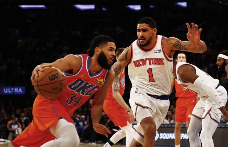 Feb 14, 2022; New York, New York, USA; Oklahoma City Thunder forward Kenrich Williams (34) dribbles the ball against New York Knicks forward Obi Toppin (1) during the first half at Madison Square Garden. Mandatory Credit: Andy Marlin-USA TODAY Sports