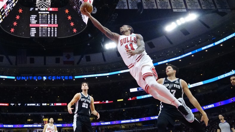 Feb 14, 2022; Chicago, Illinois, USA; Chicago Bulls forward DeMar DeRozan (11) scores against the San Antonio Spurs during the second half at United Center. Mandatory Credit: David Banks-USA TODAY Sports