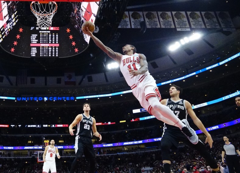 Feb 14, 2022; Chicago, Illinois, USA; Chicago Bulls forward DeMar DeRozan (11) scores against the San Antonio Spurs during the second half at United Center. Mandatory Credit: David Banks-USA TODAY Sports