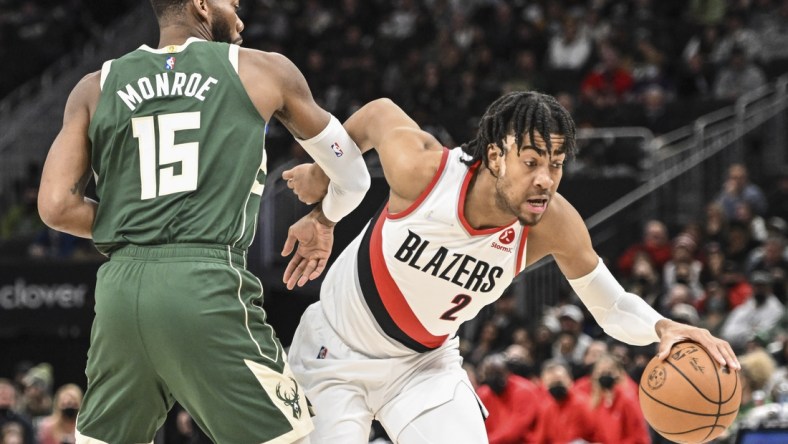 Feb 14, 2022; Milwaukee, Wisconsin, USA; Portland Trail Blazers forward Trendon Watford (2) drives for the basket against Milwaukee Bucks center Greg Monroe (15) in the fourth quarter at Fiserv Forum. Mandatory Credit: Benny Sieu-USA TODAY Sports