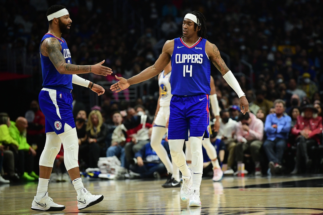 Feb 14, 2022; Los Angeles, California, USA; Los Angeles Clippers guard Terance Mann (14) reacts with forward Marcus Morris Sr. (8) after scoring a basket and drawing the foul against the Golden State Warriors during the second half at Crypto.com Arena. Mandatory Credit: Gary A. Vasquez-USA TODAY Sports