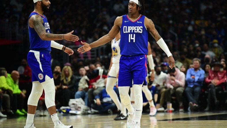 Feb 14, 2022; Los Angeles, California, USA; Los Angeles Clippers guard Terance Mann (14) reacts with forward Marcus Morris Sr. (8) after scoring a basket and drawing the foul against the Golden State Warriors during the second half at Crypto.com Arena. Mandatory Credit: Gary A. Vasquez-USA TODAY Sports