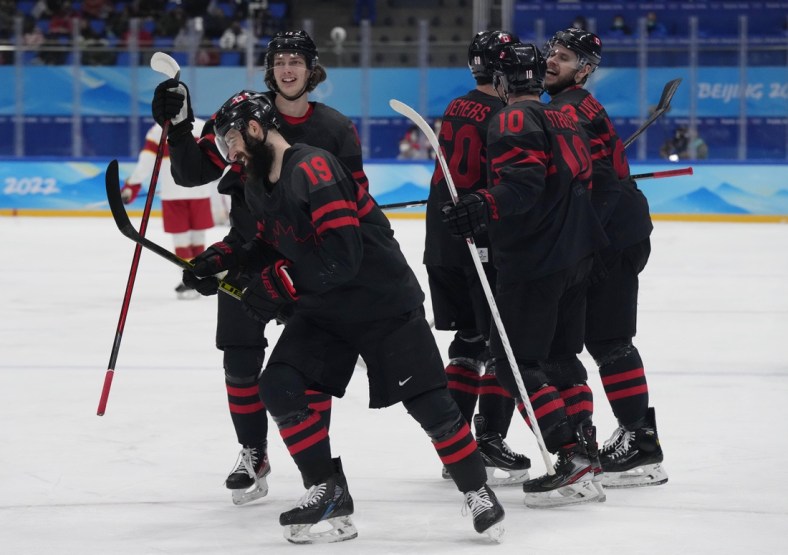 Feb 15, 2022; Beijing, China; Team Canada forward Eric O'Dell (19) celebrates his goal against China during the second period in a men's ice hockey qualification match for the quarterfinals during the Beijing 2022 Olympic Winter Games at National Indoor Stadium. Mandatory Credit: George Walker IV-USA TODAY Sports