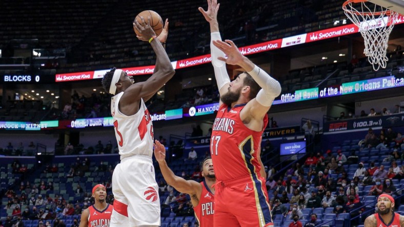 Feb 14, 2022; New Orleans, Louisiana, USA; Toronto Raptors forward Pascal Siakam (43) shoots a jump shot over New Orleans Pelicans center Jonas Valanciunas (17) during the first half at the Smoothie King Center. Mandatory Credit: Stephen Lew-USA TODAY Sports