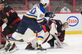 Feb 15, 2022; Ottawa, Ontario, CAN; Ottawa Senators goalie Matt Murray (30) makes a save in front of St. Louis Blues left wing Brandon Saad (20) in the first period at the Canadian Tire Centre. Mandatory Credit: Marc DesRosiers-USA TODAY Sports