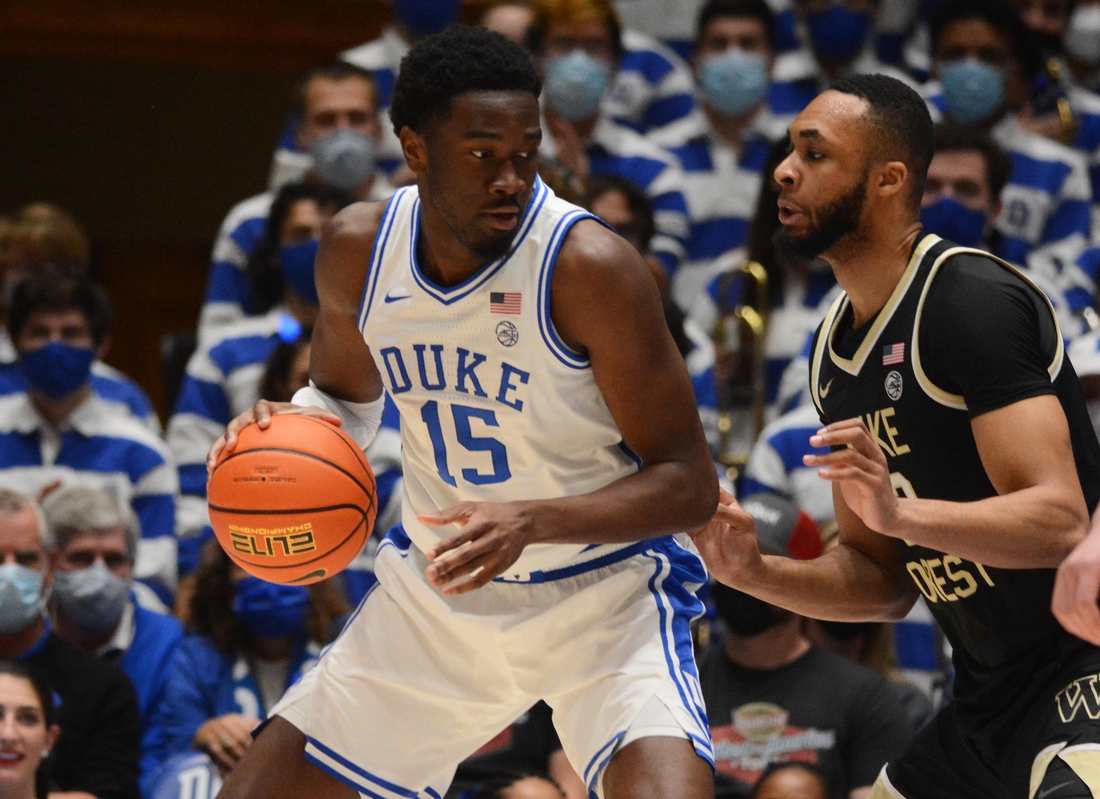 Feb 15, 2022; Durham, North Carolina, USA; Duke Blue Devils center Mark Williams (15) moves the ball against Wake Forest Demon Deacons forward Dallas Walton (13) during the first half at Cameron Indoor Stadium. Mandatory Credit: Rob Kinnan-USA TODAY Sports