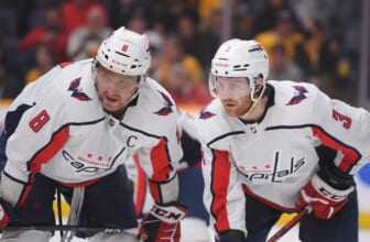 Feb 15, 2022; Nashville, Tennessee, USA;  Washington Capitals left wing Alex Ovechkin (8) and defenseman Nick Jensen (3) discuss the face off against the Nashville Predators during the third period at Bridgestone Arena. Mandatory Credit: Steve Roberts-USA TODAY Sports