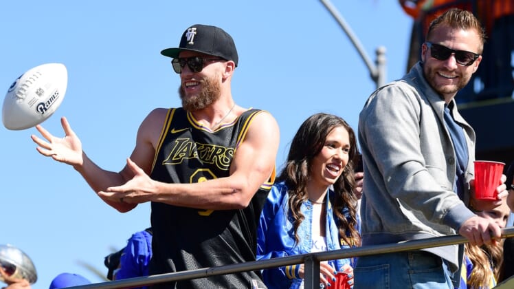 Feb 16, 2022; Los Angeles, CA, USA; Los Angeles Rams wide receiver Cooper Kupp and head coach Sean McVay celebrate during the championship victory parade. Mandatory Credit: Gary A. Vasquez-USA TODAY Sports
