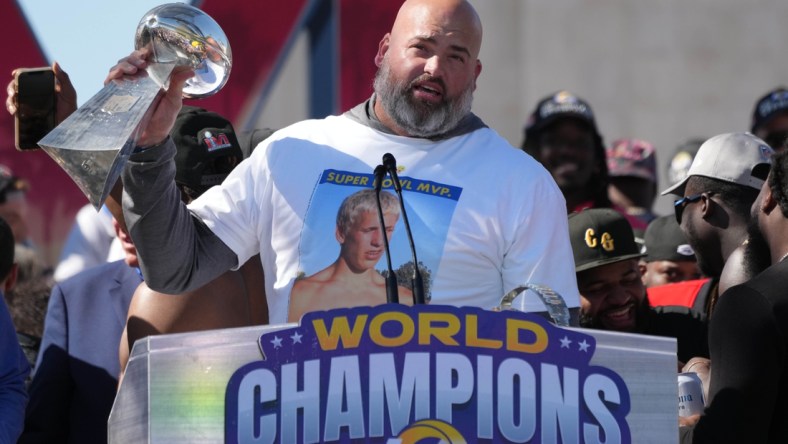 Feb 16, 2022; Los Angeles, CA, USA; Los Angeles Rams tackle Andrew Whitworth holds the Vince Lombardi trophy during the Super Bowl LVI championship rally at the Los Angeles Memorial Coliseum. Mandatory Credit: Kirby Lee-USA TODAY Sports