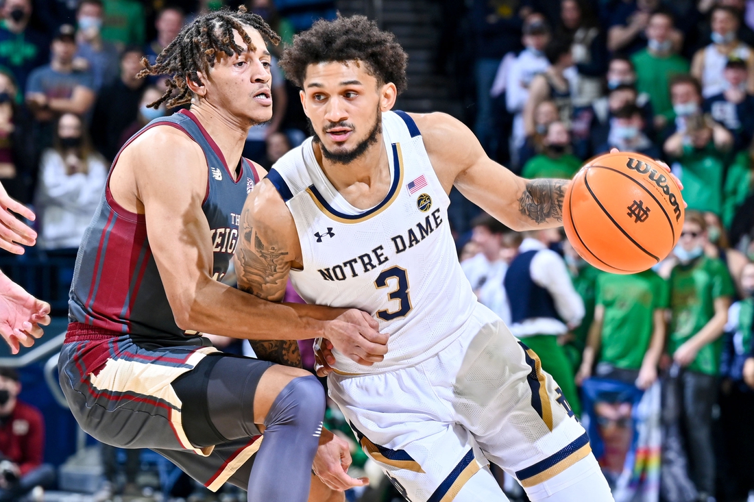 Feb 16, 2022; South Bend, Indiana, USA; Notre Dame Fighting Irish guard Prentiss Hubb (3) drives to the basket as Boston College Eagles guard Makai Ashton-Langford (11) defends in the second half at the Purcell Pavilion. Mandatory Credit: Matt Cashore-USA TODAY Sports