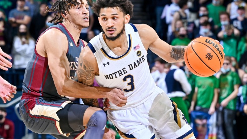 Feb 16, 2022; South Bend, Indiana, USA; Notre Dame Fighting Irish guard Prentiss Hubb (3) drives to the basket as Boston College Eagles guard Makai Ashton-Langford (11) defends in the second half at the Purcell Pavilion. Mandatory Credit: Matt Cashore-USA TODAY Sports