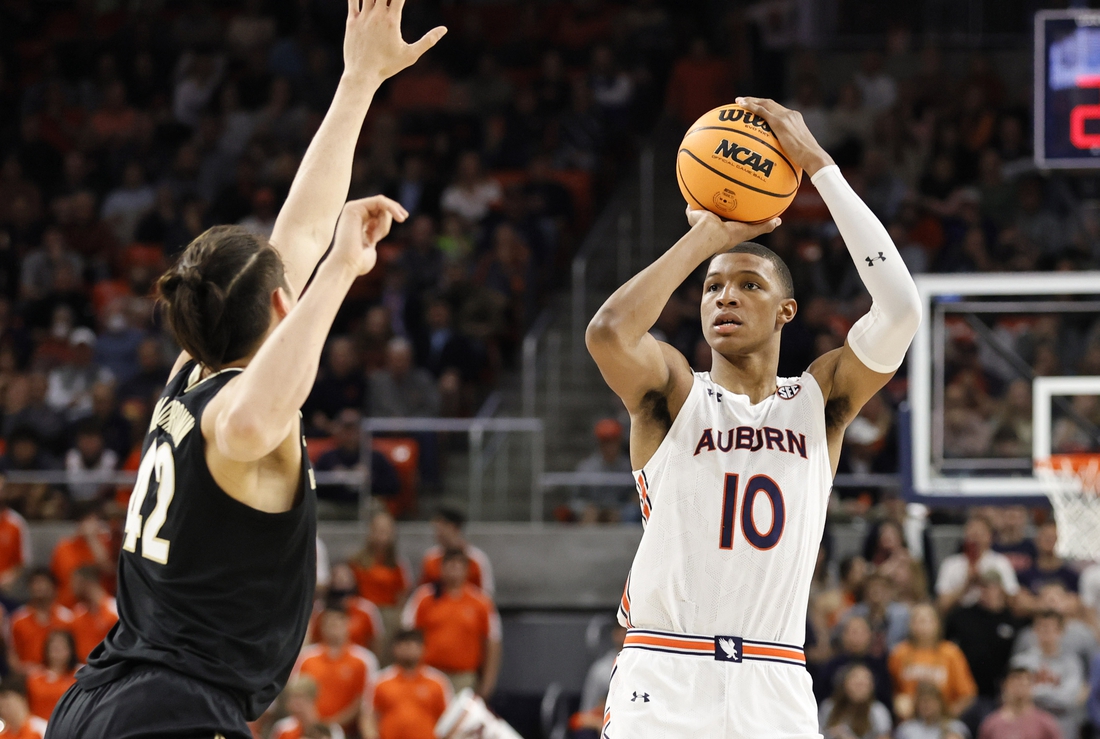 Feb 16, 2022; Auburn, Alabama, USA;  Auburn Tigers forward Jabari Smith (10) takes a shot against Vanderbilt Commodores forward Quentin Millora-Brown (42) during the second half at Auburn Arena.  Smith led all scoring with 31 points. Mandatory Credit: John Reed-USA TODAY Sports