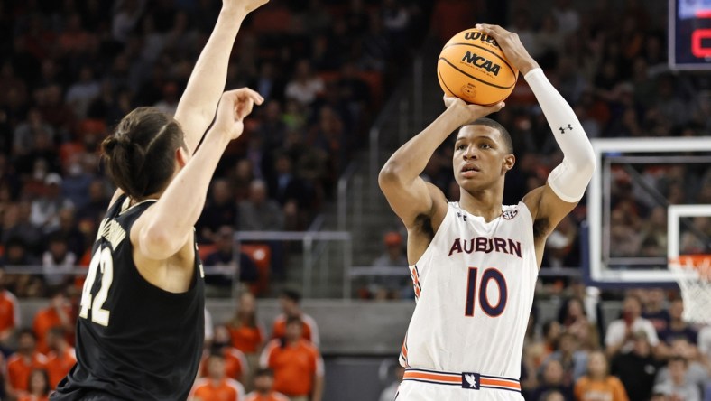 Feb 16, 2022; Auburn, Alabama, USA;  Auburn Tigers forward Jabari Smith (10) takes a shot against Vanderbilt Commodores forward Quentin Millora-Brown (42) during the second half at Auburn Arena.  Smith led all scoring with 31 points. Mandatory Credit: John Reed-USA TODAY Sports