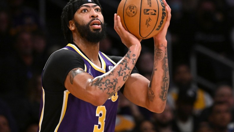 Feb 16, 2022; Los Angeles, California, USA; Los Angeles Lakers forward Anthony Davis (3) lines up a shot in the first half against the Utah Jazz at Crypto.com Arena. Mandatory Credit: Jayne Kamin-Oncea-USA TODAY Sports