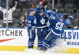 Feb 17, 2022; Toronto, Ontario, CAN; Toronto  Maple Leafs center Auston Matthews (34) celebrates scoring a goal with Toronto Maple Leafs left wing Michael Bunting (58) during the first period against the Pittsburgh Penguins at Scotiabank Arena. Mandatory Credit: Nick Turchiaro-USA TODAY Sports