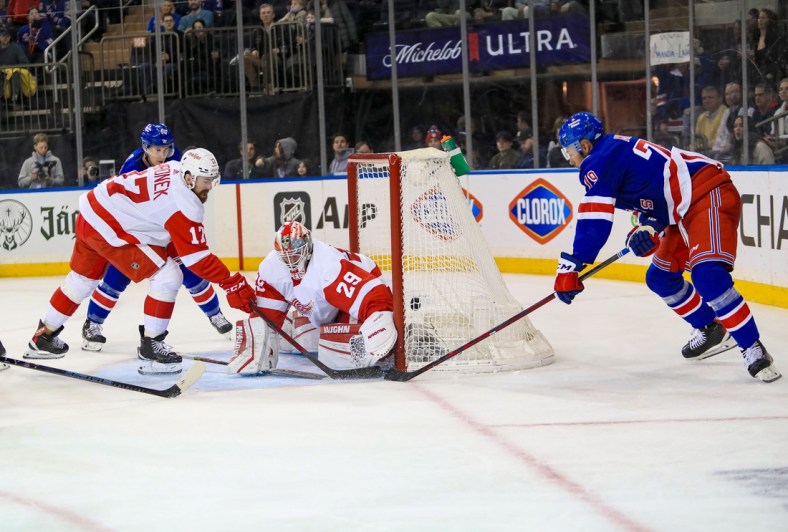 Feb 17, 2022; New York, New York, USA; New York Rangers defenseman K'Andre Miller (79) scores a wrap-around goal on Detroit Red Wings defenseman Gustav Lindstrom (28) during the second period at Madison Square Garden. Mandatory Credit: Danny Wild-USA TODAY Sports