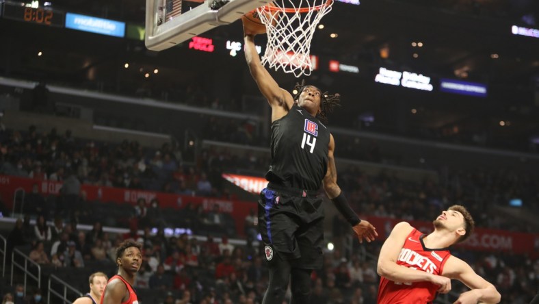 Feb 17, 2022; Los Angeles, California, USA; Los Angeles Clippers guard Terance Mann (14) dunks a ball during the first quarter against the Houston Rockets at Crypto.com Arena. Mandatory Credit: Kiyoshi Mio-USA TODAY Sports