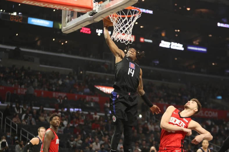 Feb 17, 2022; Los Angeles, California, USA; Los Angeles Clippers guard Terance Mann (14) dunks a ball during the first quarter against the Houston Rockets at Crypto.com Arena. Mandatory Credit: Kiyoshi Mio-USA TODAY Sports