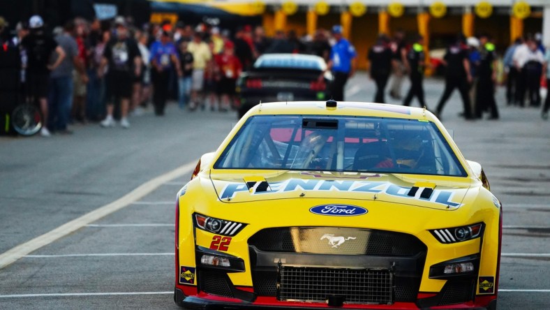 Feb 18, 2022; Daytona Beach, Florida, USA; NASCAR Cup Series driver Joey Logano (22) heads out of the garage area during practice for the Daytona 500 at Daytona International Speedway. Mandatory Credit: John David Mercer-USA TODAY Sports