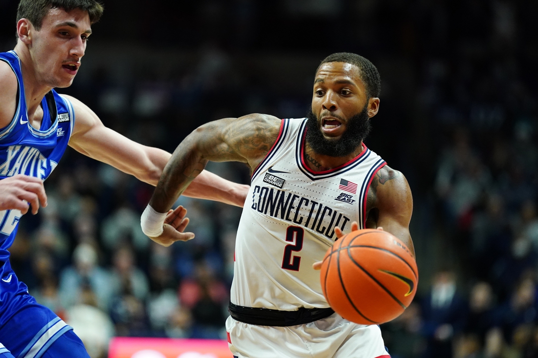 Feb 19, 2022; Storrs, Connecticut, USA; Connecticut Huskies guard R.J. Cole (2) drives the ball against Xavier Musketeers forward Zach Freemantle (32) in the first half at Harry A. Gampel Pavilion. Mandatory Credit: David Butler II-USA TODAY Sports