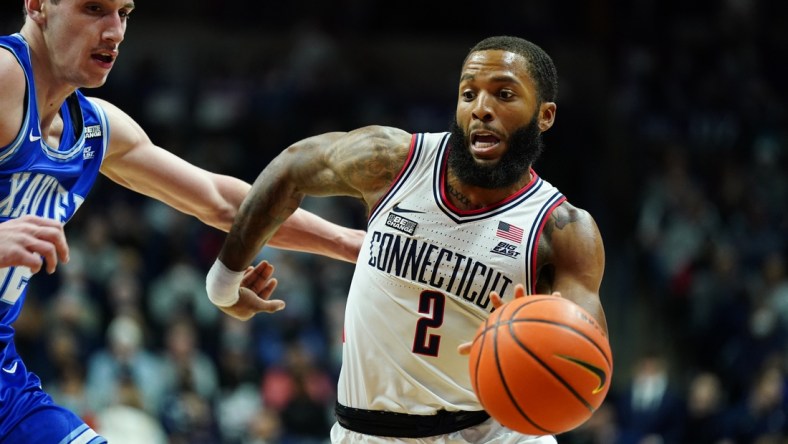 Feb 19, 2022; Storrs, Connecticut, USA; Connecticut Huskies guard R.J. Cole (2) drives the ball against Xavier Musketeers forward Zach Freemantle (32) in the first half at Harry A. Gampel Pavilion. Mandatory Credit: David Butler II-USA TODAY Sports