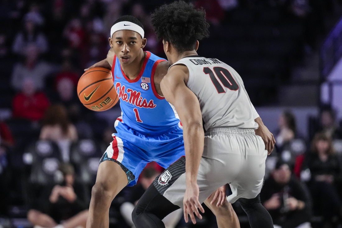 Feb 19, 2022; Athens, Georgia, USA; Mississippi Rebels guard Austin Crowley (1) dribbles against Georgia Bulldogs guard Aaron Cook (10) during the first half at Stegeman Coliseum. Mandatory Credit: Dale Zanine-USA TODAY Sports