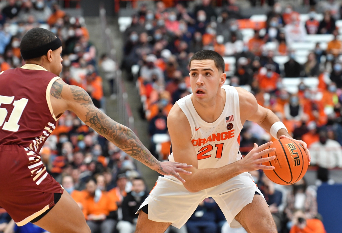 Feb 19, 2022; Syracuse, New York, USA; Syracuse Orange forward Cole Swider (21) faces off against Boston College Eagles guard Brevin Galloway (51) in the second half at the Carrier Dome. Mandatory Credit: Mark Konezny-USA TODAY Sports