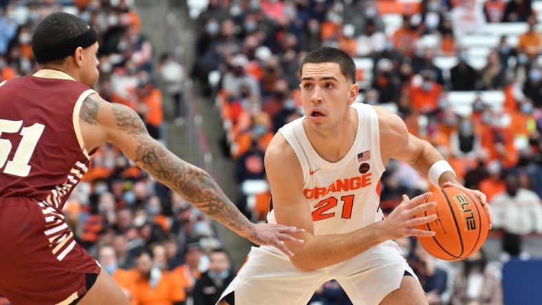 Feb 19, 2022; Syracuse, New York, USA; Syracuse Orange forward Cole Swider (21) faces off against Boston College Eagles guard Brevin Galloway (51) in the second half at the Carrier Dome. Mandatory Credit: Mark Konezny-USA TODAY Sports