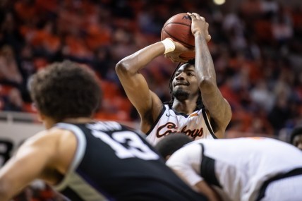 Feb 19, 2022; Stillwater, Oklahoma, USA; Oklahoma State Cowboys forward Kalib Boone (22) shoots a free throw against the Kansas State Wildcats during the first half at Gallagher-Iba Arena. Mandatory Credit: Rob Ferguson-USA TODAY Sports
