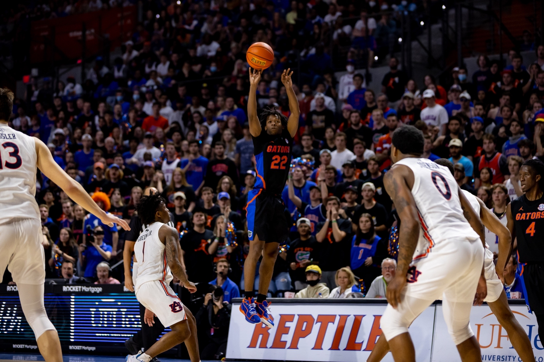 Feb 19, 2022; Gainesville, Florida, USA; Florida Gators guard Tyree Appleby (22) makes a three pointer during the second half against the Auburn Tigers at Billy Donovan Court at Exactech Arena. Mandatory Credit: Matt Pendleton-USA TODAY Sports