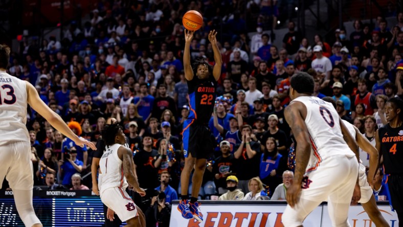 Feb 19, 2022; Gainesville, Florida, USA; Florida Gators guard Tyree Appleby (22) makes a three pointer during the second half against the Auburn Tigers at Billy Donovan Court at Exactech Arena. Mandatory Credit: Matt Pendleton-USA TODAY Sports