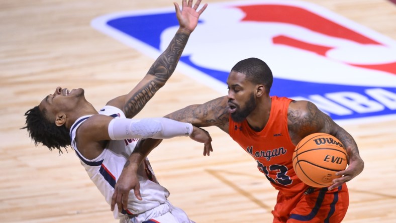 Feb 19, 2022; Cleveland, OH, USA; Howard Bison guard Elijah Hawkins (3) is pushed by Morgan State Bears guard Seventh Woods (23) during the NBA HBCU Classic at Wolstein Center. Mandatory Credit: David Richard-USA TODAY Sports